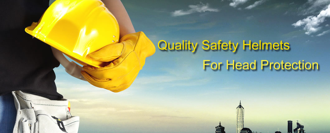 A yellow safety helmet is in a man’s hand